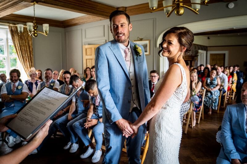 A couple say their vows in the great hall of Solton Manor, near Walmer, Kent, England