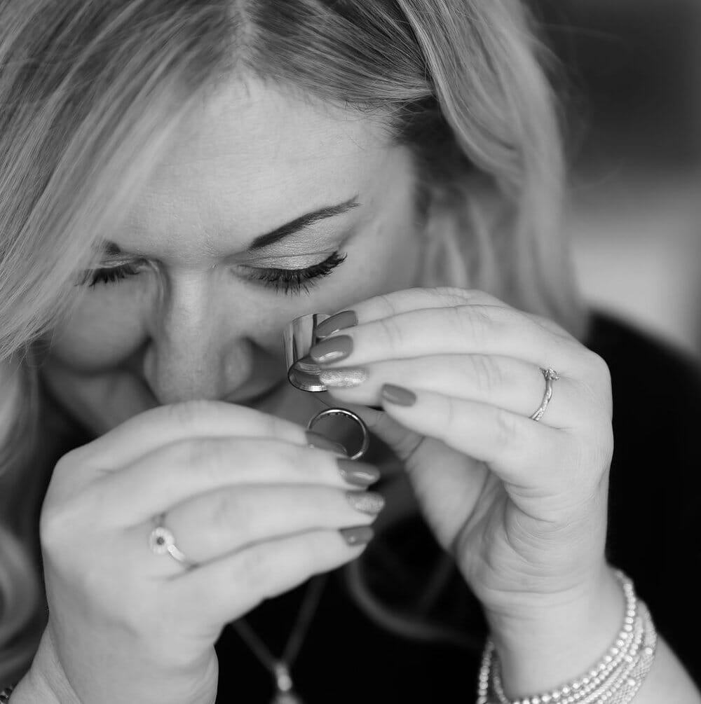 A jeweller located near to Solton Manor in Dover, looks carefully at an engagement ring
