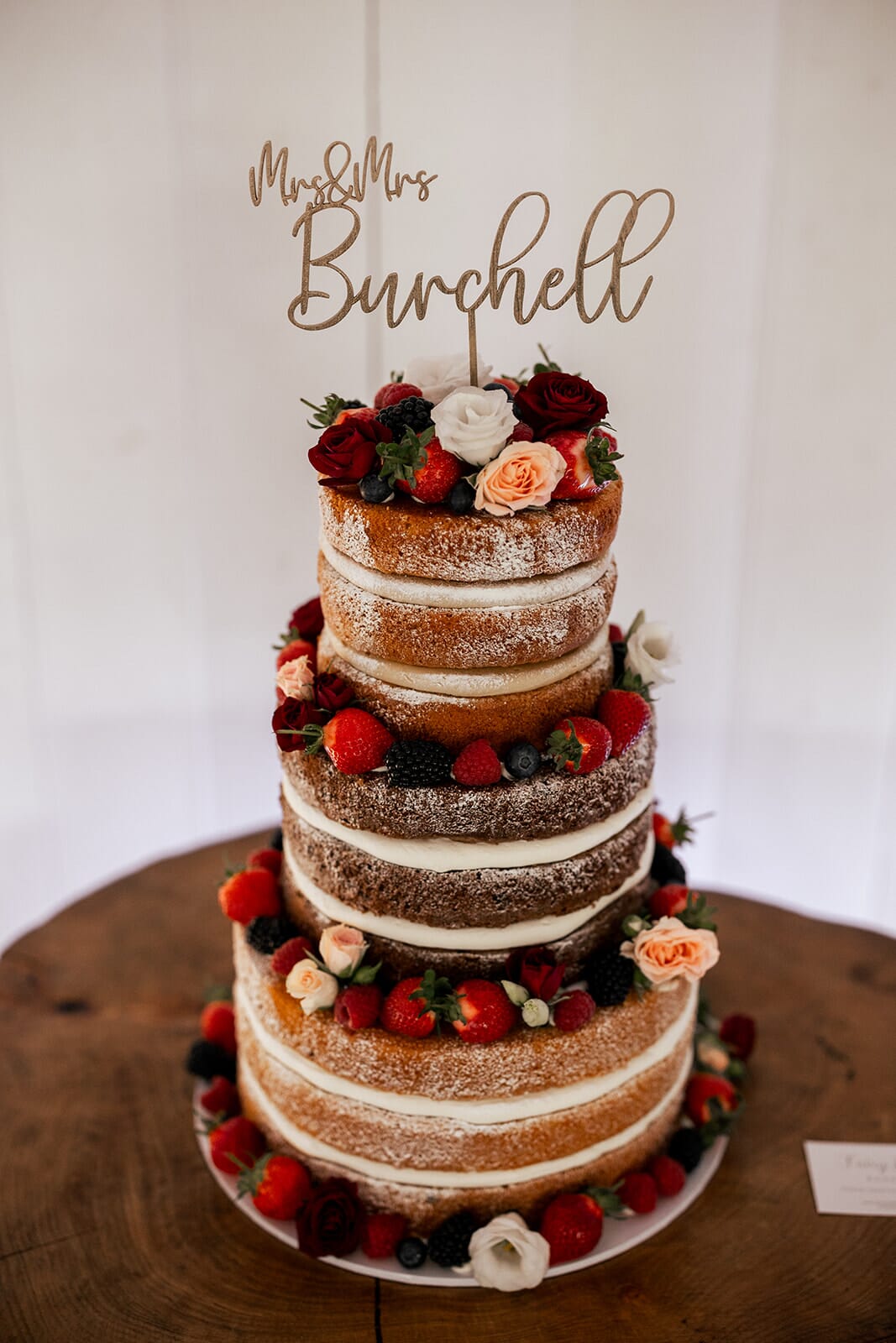 Naked wedding cake with bespoke topper