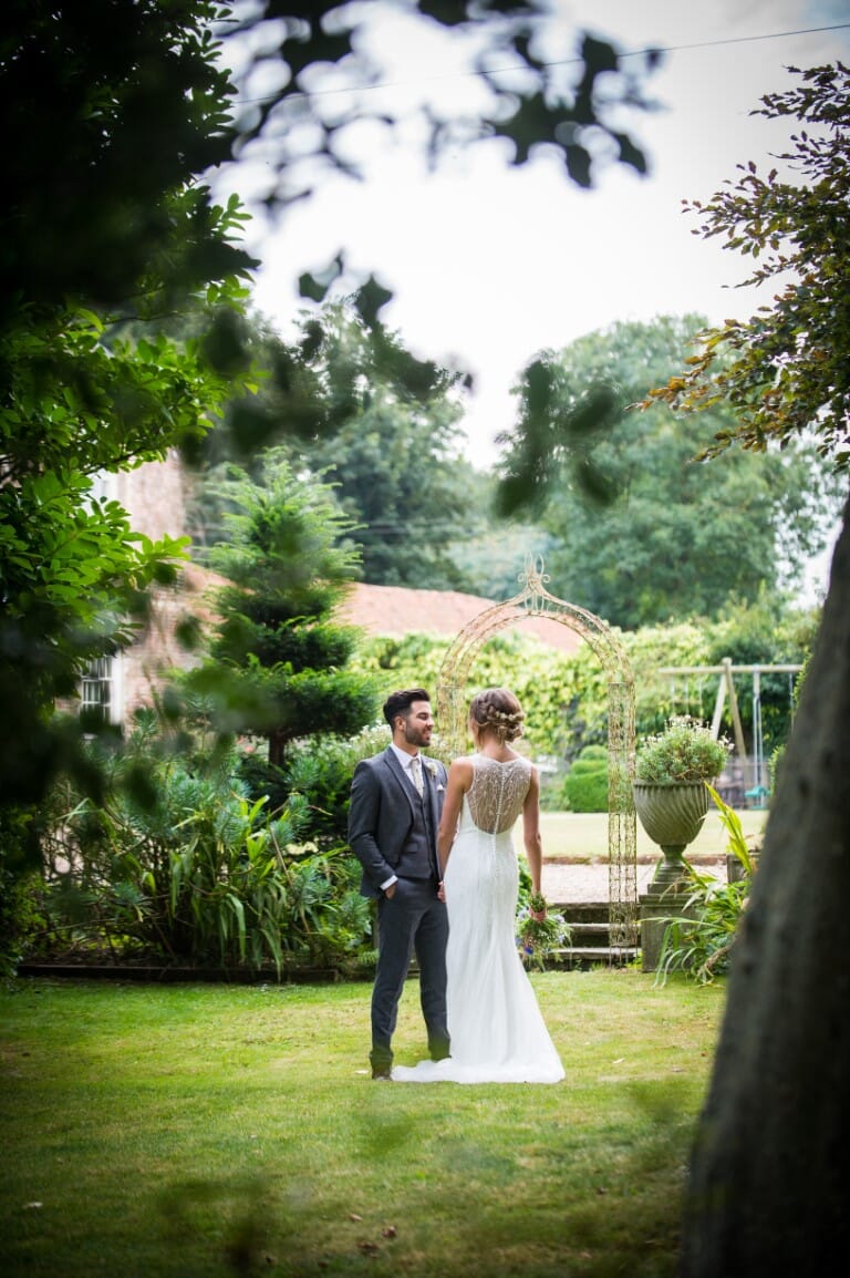 A newly married couple in the garden of Solton Manor near Walmer