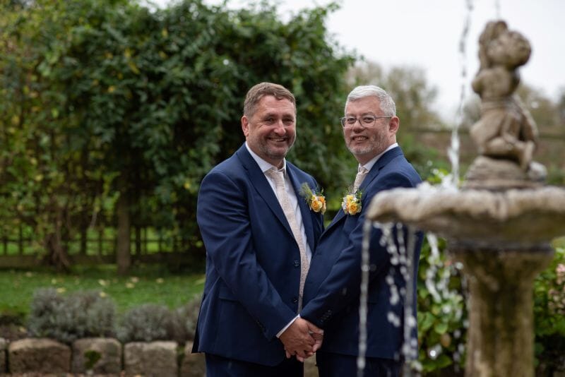 Paul and Martin stand infront of the wishing fountain located infront of the manor house at Solton, East langdon, Dover, Kent