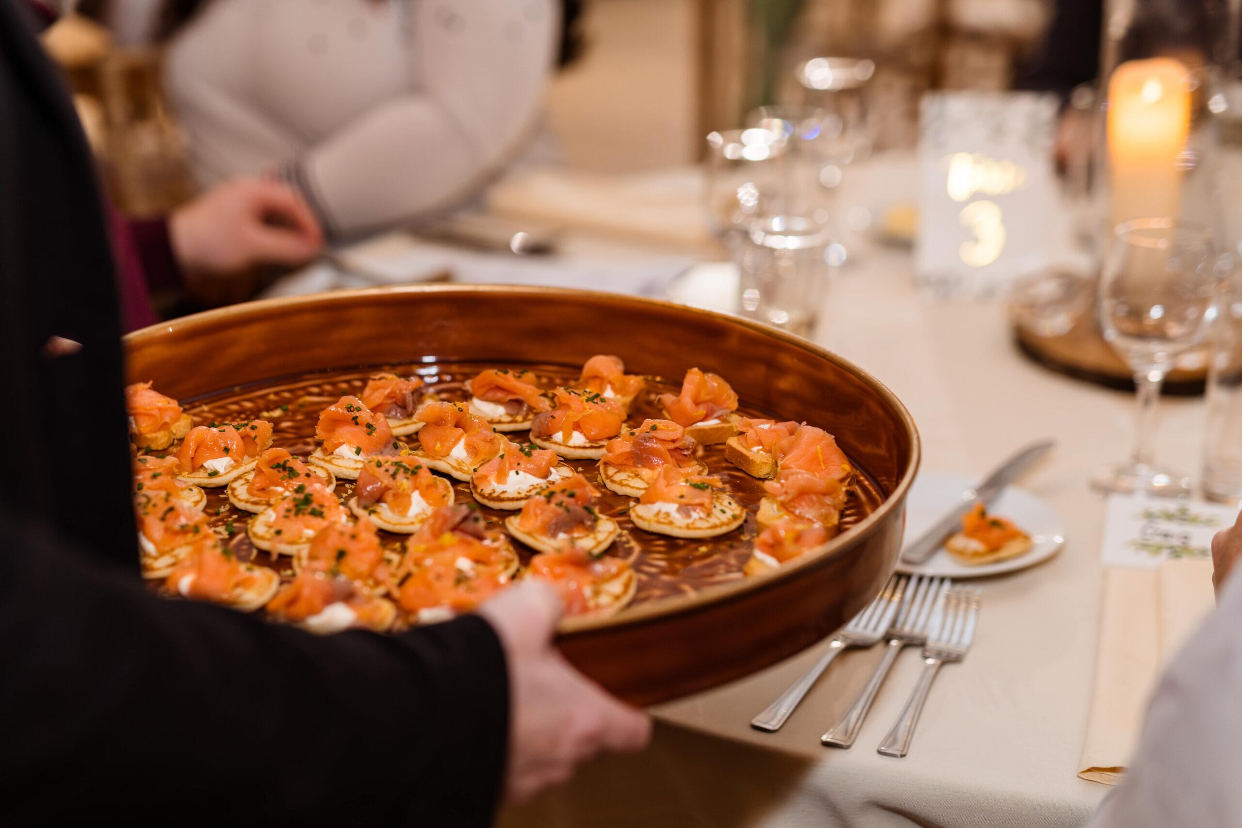 A member of staff holds a tray of Bellini canapes during a Tasting Evening at Solton Manor, East Langdon, Dover, Kent, England