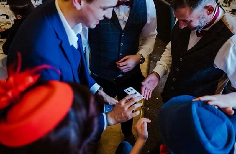 A magician entertains wedding guests in Kent