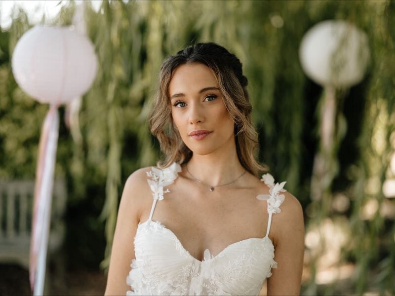 A bride stands in the grounds of Solton Manor, Kent, England, United Kingdom
