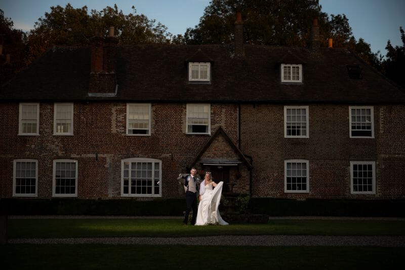 A couple stand outside the Manor on the Solton Estate, near Dover, Kent, England UK