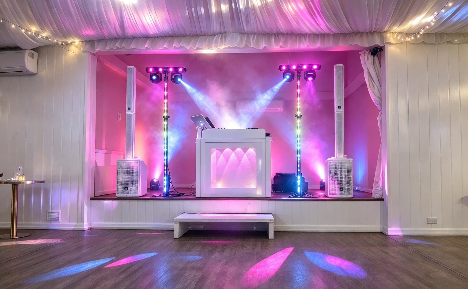 A DJ set up on the stage in the large Dutch Barn at Solton Manor, between Dover and Sandwich, Kent, England