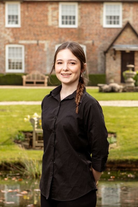 Issy is the Apprentice at Solton Manor, Dover, Kent, England planting an apple tree in the old Orchard