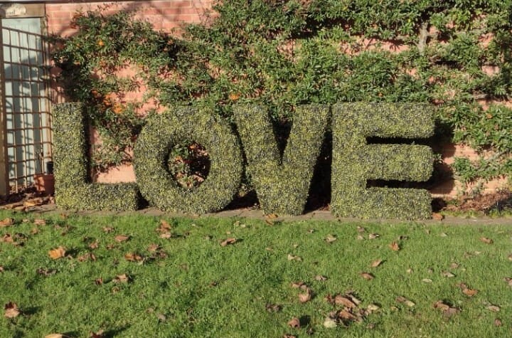 Faux hedge wedding LOVE letters, perfect for Solton Manor's quinessentially English Garden