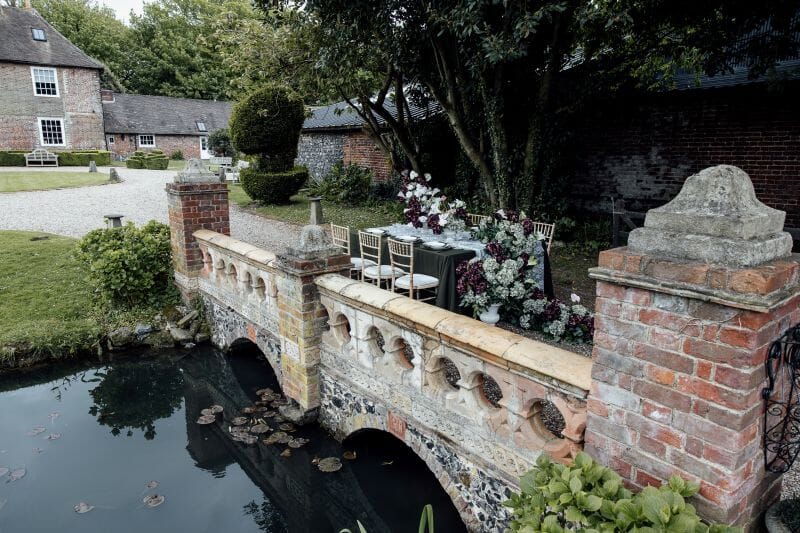 A styled table set up outside Solton Manor Country House on the Ponte Vecchio Bridge, Kent, England