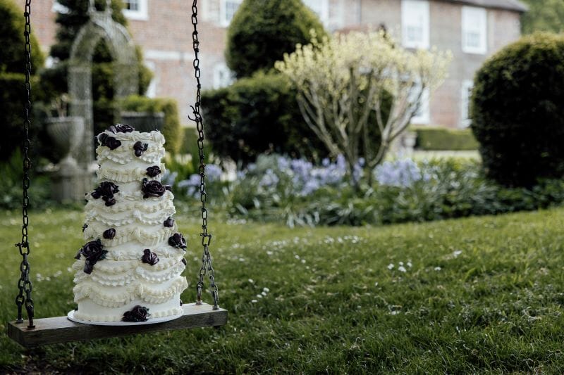 A Lambeth Wedding Cake resting on the swing at Solton Manor, between Dover and Deal in Kent, England
