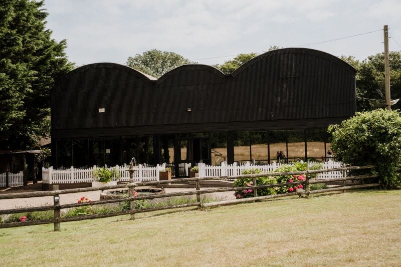 The Dutch Barn at Solton Manor is an old farm storage unit used for wedding receptions, seating up to 200 and 250 in the evening.